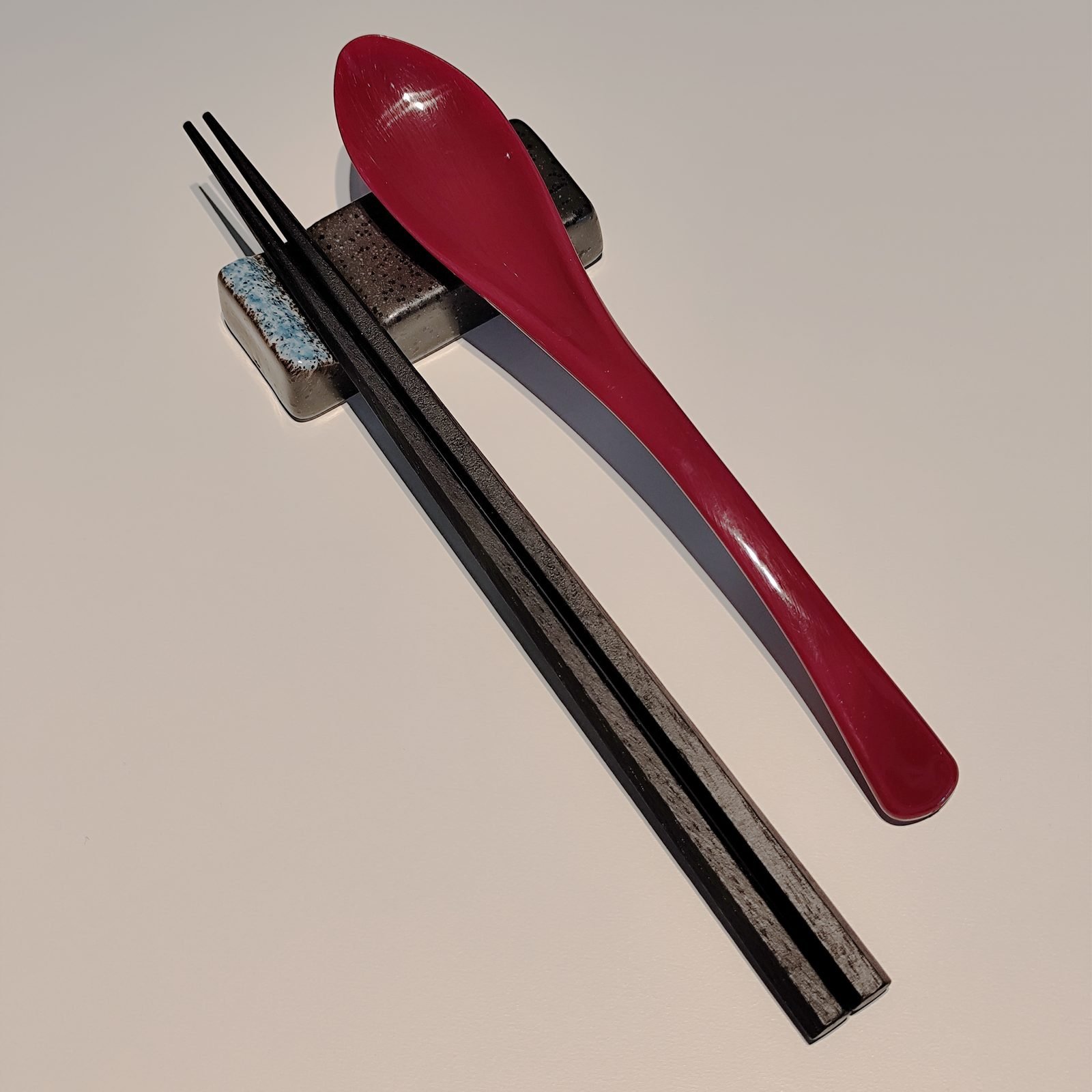 Wooden spoon and chopsticks set on a cloth pouch